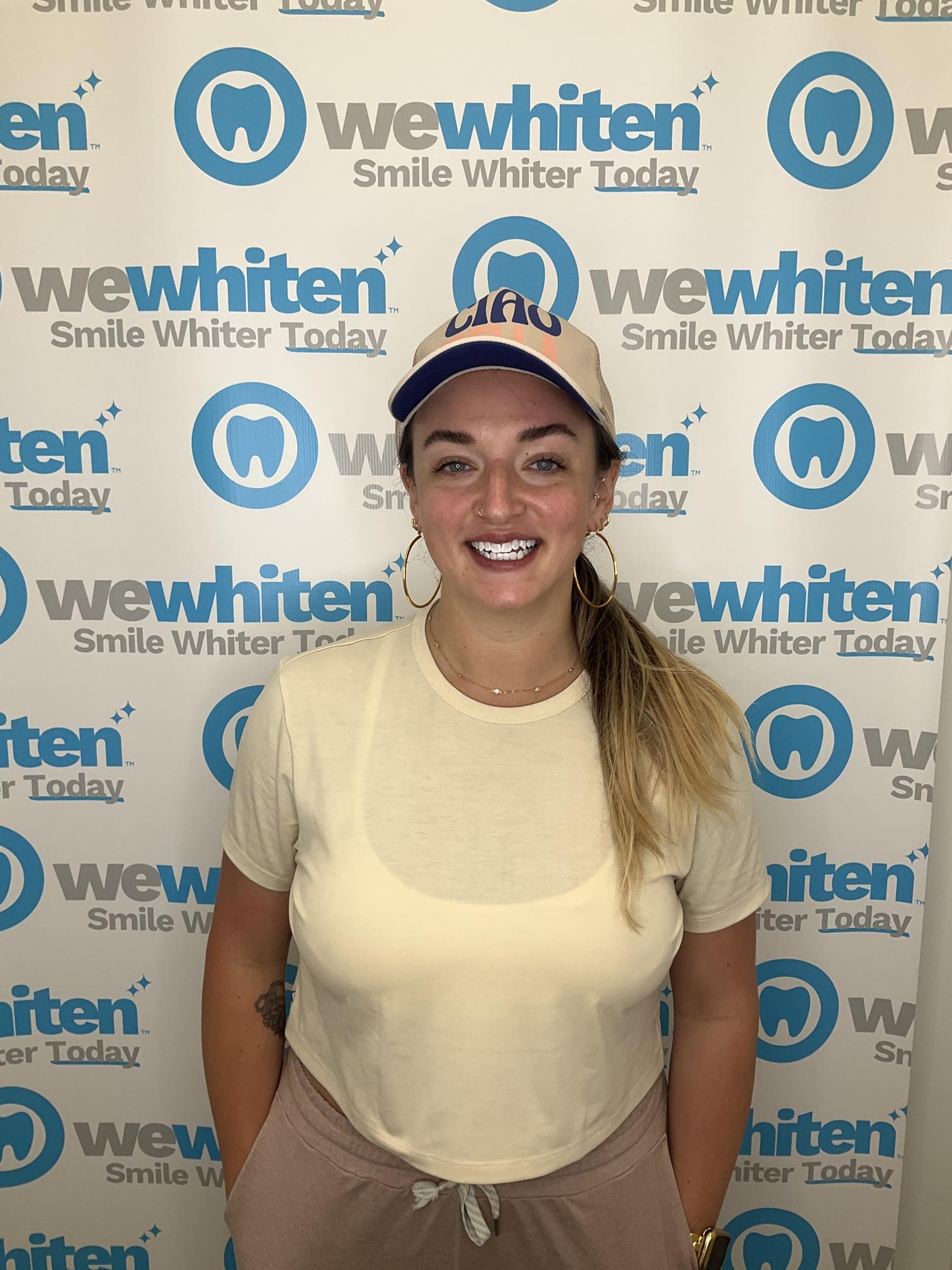 Dr Katie of Inclusive Natural Medicine smiles with her bright white teeth.