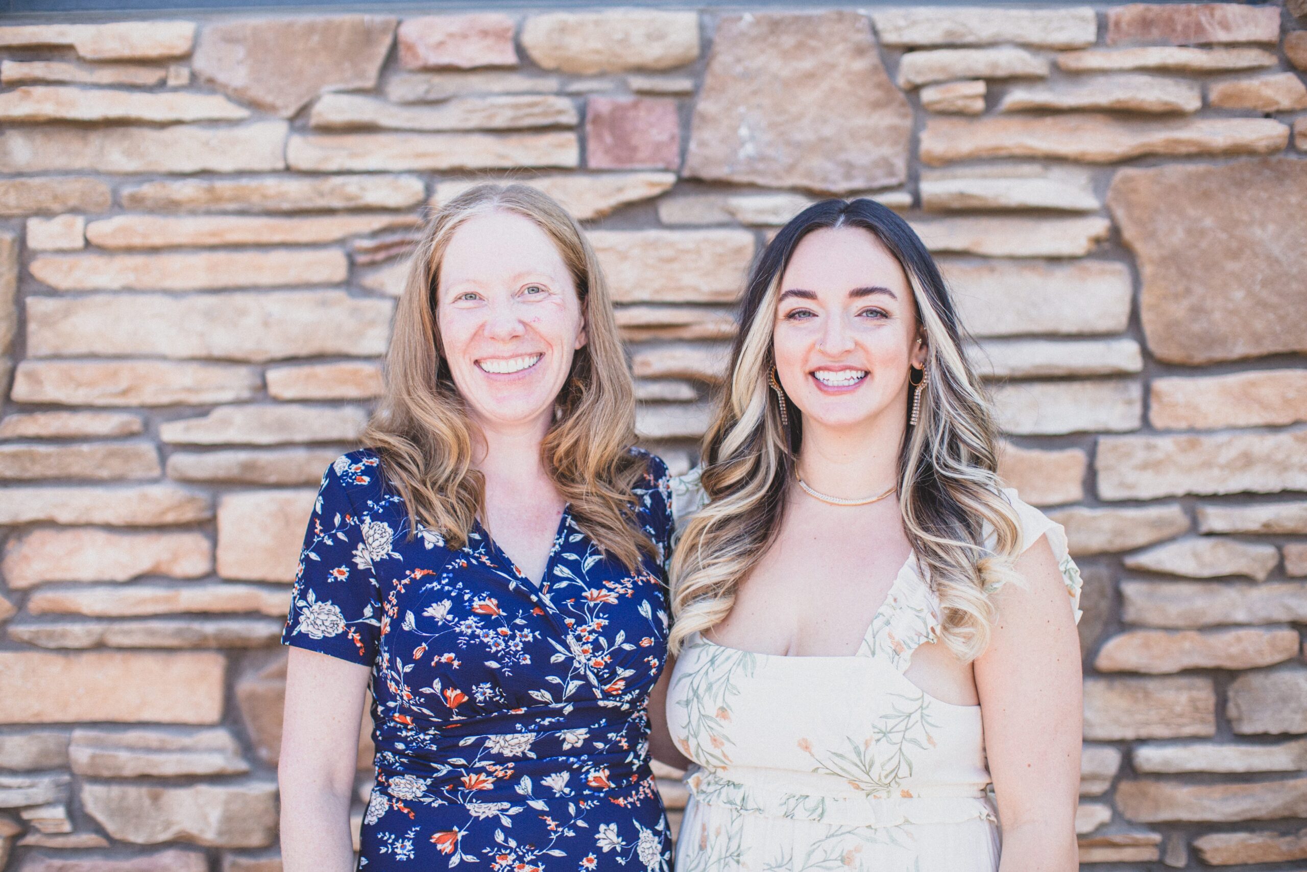 Dr. Katie Schneller and Dr. Sally pose side-by-side outside of their naturopathic clinic; inclusive natural medicine in Tempe Arizona.